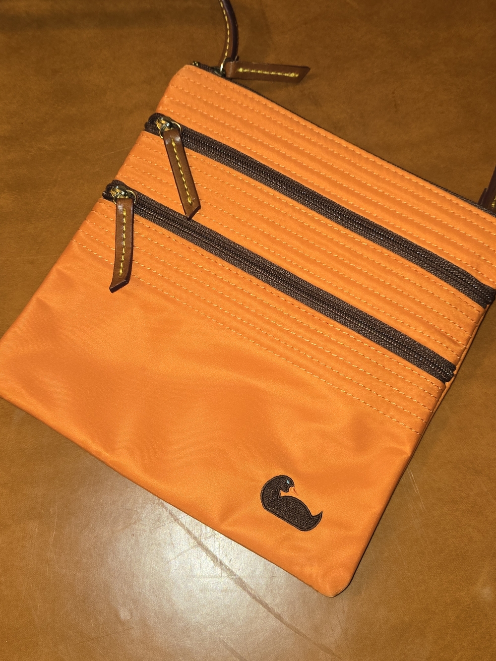 Dooney & Bourke Orange Crossbody Bag with Brown Accents